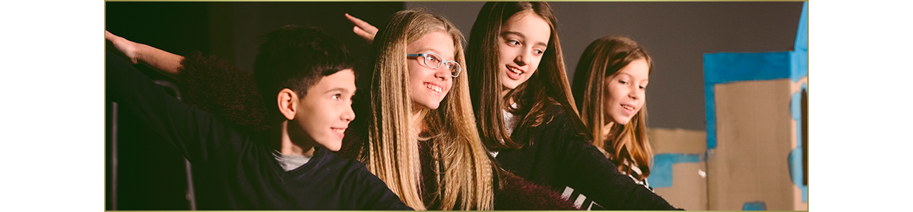 Children taking an acting class.